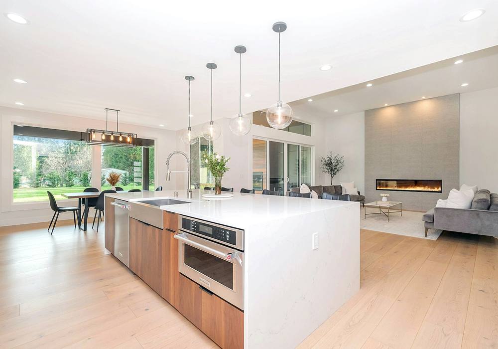 Open-plan luxury kitchen with built-in appliances and an island