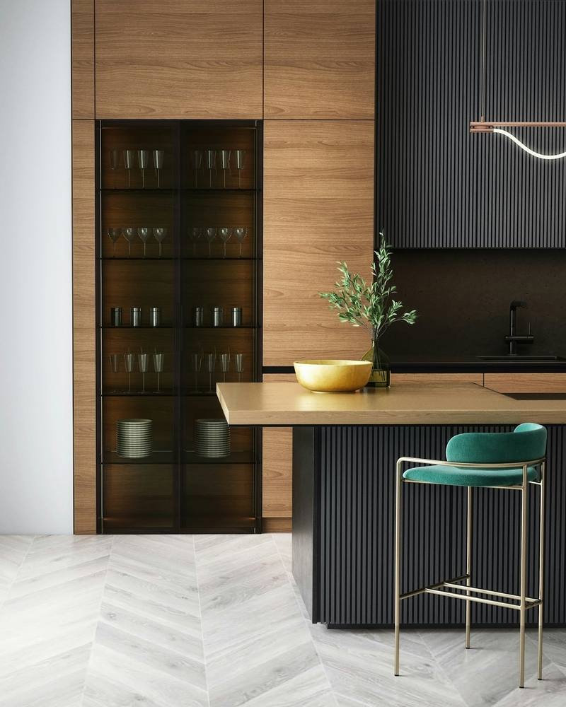Tall integrated cabinetry housing built-in refrigeration in a dark kitchen